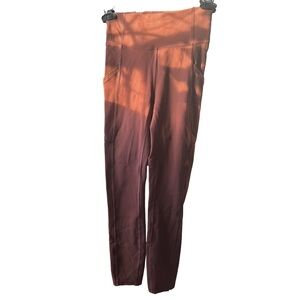 Lululemon women’s sz 2 Burnt Orange Leggings(solid color sorry for the sunlight)
